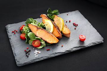 Image showing Grilled salmon on lettuce