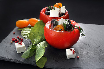 Image showing Colorful starter. Vegetable appetizer. Stuffed tomatoes.