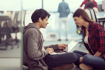 Image showing software developers couple working on the floor