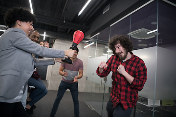 Image showing multiethnics business team boxing at office