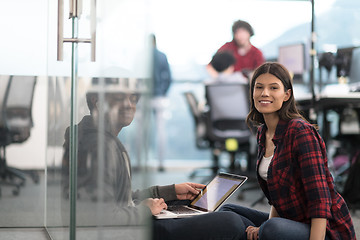 Image showing software developers couple working on the floor