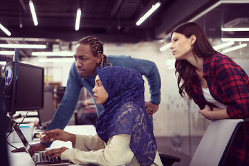 Image showing multiethnics team of software developers working together