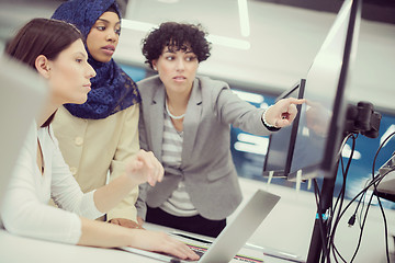 Image showing multiethnics team of software developers working together