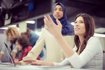 Image showing multiethnics team of software developers working together