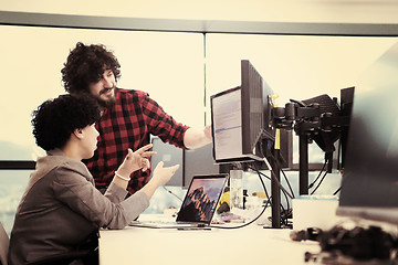 Image showing software developers couple writing programming code