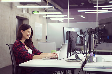 Image showing female software developer using laptop computer