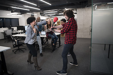 Image showing multiethnics business team boxing at office