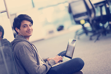 Image showing software developer working on the floor