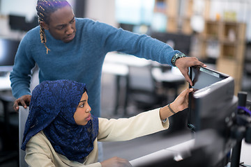 Image showing young black muslim female software developer at work