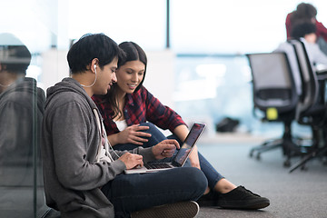 Image showing software developers couple working on the floor