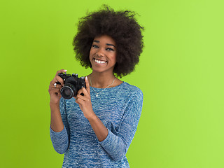 Image showing black girl taking photo on a retro camera