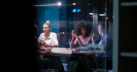 Image showing Multiethnic startup business team in night office