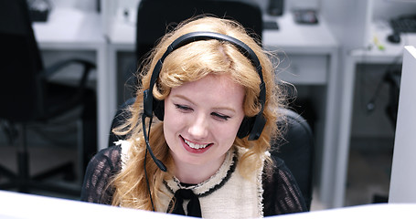 Image showing female call centre operator doing her job