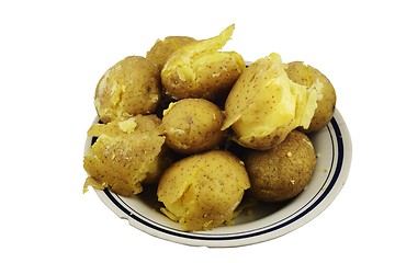 Image showing crumbly jacket potatoes in a plate on a white