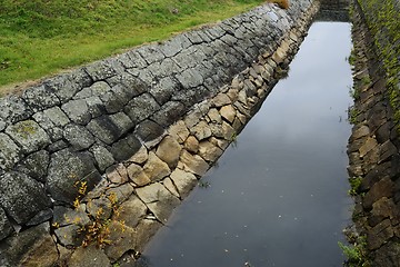 Image showing old moat laid out in stone 