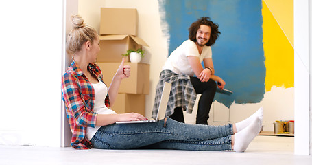 Image showing Happy couple doing home renovations