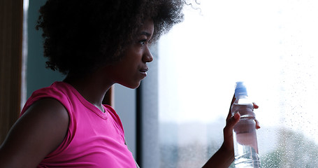 Image showing portrait of young afro american woman in gym on workout break