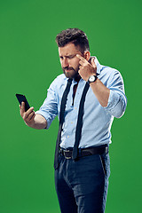 Image showing Handsome businessman with mobile phone