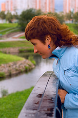 Image showing redhead woman on the bridge