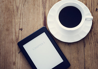 Image showing E-book reader and coffee