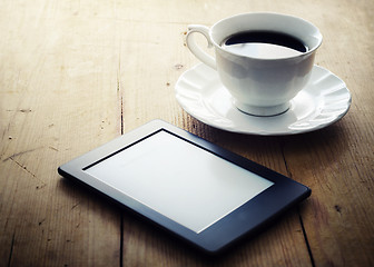 Image showing E-book reader and coffee