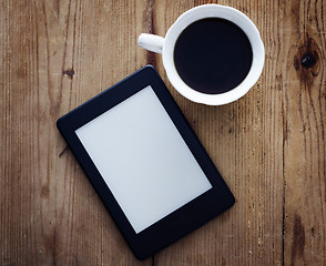 Image showing E-book reader and coffee