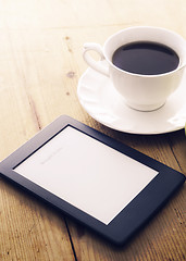 Image showing E-book reader and coffee