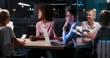 Image showing Multiethnic startup business team in night office