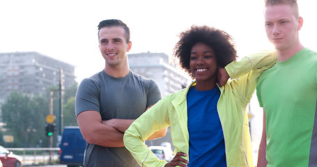 Image showing Portrait of multiethnic group of young people on the jogging