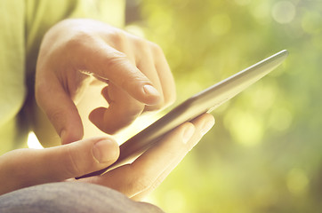 Image showing Man holding tablet