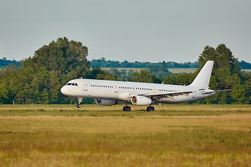 Image showing Plane landing on runway