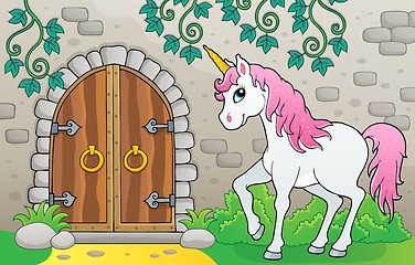 Image showing Unicorn by old door theme image 1