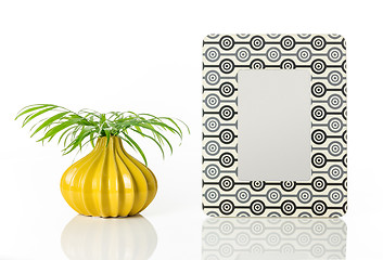 Image showing Vase with palm leaves and retro style picture frame