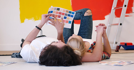 Image showing Happy young couple relaxing after painting