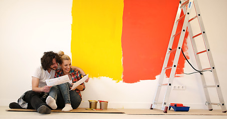 Image showing Happy young couple relaxing after painting