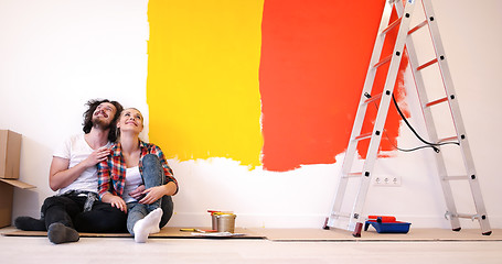 Image showing Happy young couple relaxing after painting