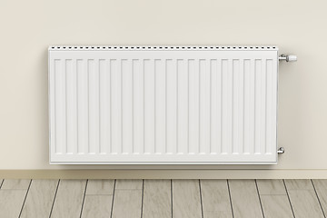 Image showing White heating radiator in the room