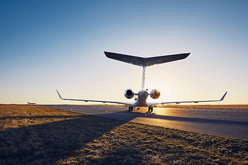 Image showing Private jet at sunset