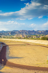 Image showing A football field on the mountain s on tha background.