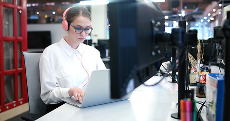 Image showing businesswoman using a laptop in startup office