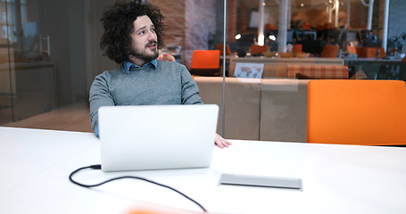 Image showing businessman working using a laptop in startup office