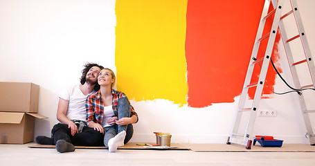 Image showing Happy young couple relaxing after painting