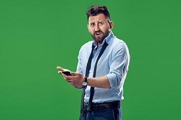 Image showing Handsome businessman with mobile phone