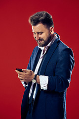 Image showing Handsome businessman with mobile phone