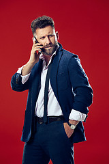 Image showing Handsome businessman with mobile phone