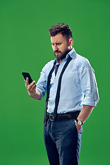 Image showing Handsome businessman with mobile phone