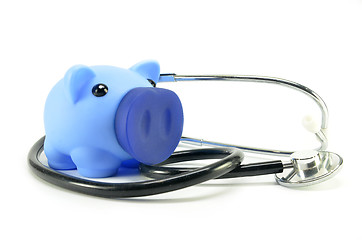 Image showing Stethoscope and piggy bank