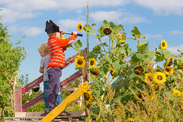 Image showing Kids playing pirates in urban gardens at Tempelhofer field, once airport, now a public park in Berlin, Germany