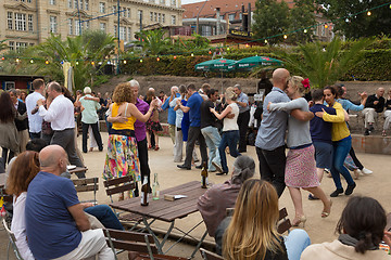 Image showing People dancing salsa outdoors at city square on one of many summer events in Berlin, Germany on 28th of september, 2016.