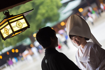 Image showing Young happy groom and bride during japanese traditional wedding ceremony at Meiji-jingu shrine in Tokyo, Japan on November 23, 2013.